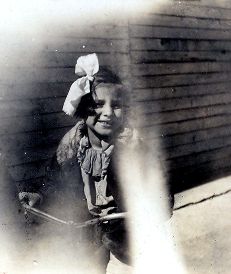 Young Esther on a tricycle